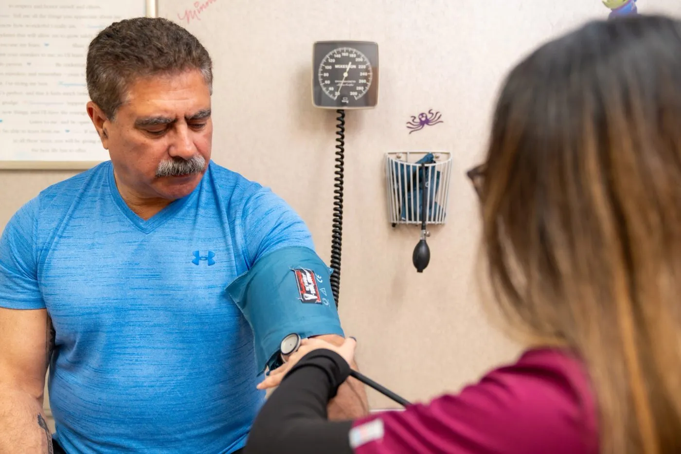 Nurse taking blood pressure