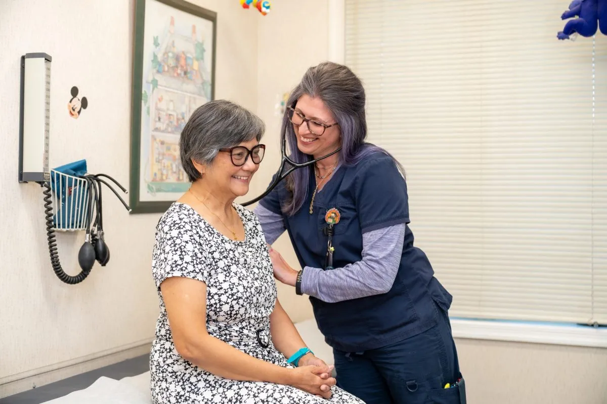 Nurse taking heart rate