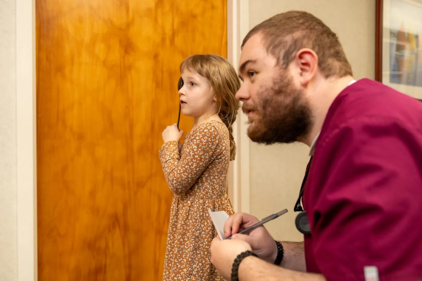 Girl Patient and Nurse eye exam left